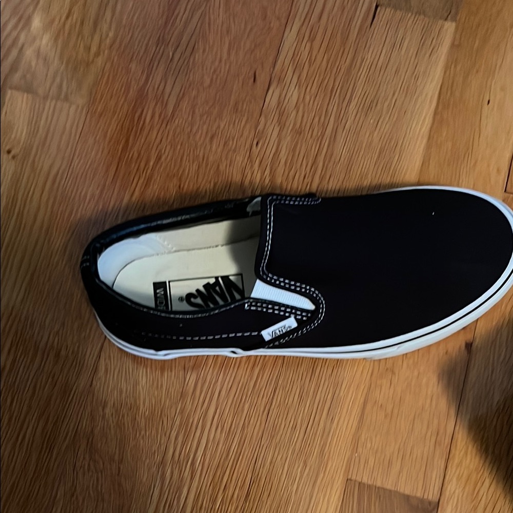 Vans Black and White Classic Slip-On Sneakers